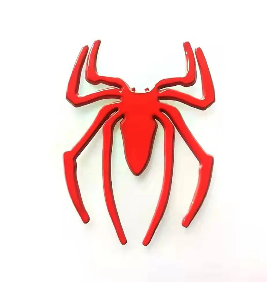 Three-dimensional metal spider car sticker in zinc alloy on a vehicle bumper.