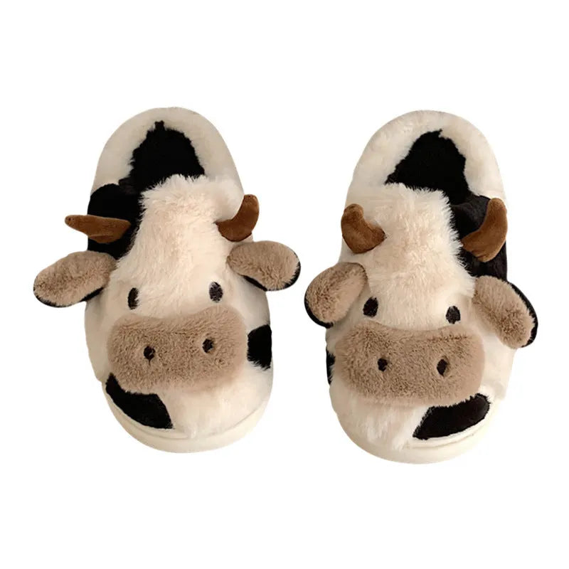 White cow-themed plush slippers for women with non-slip textured soles