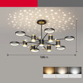Black 13-head iron pendant chandelier with remote control on a ceiling.