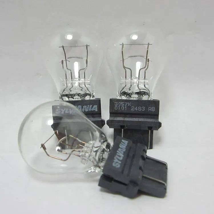 Wagner brake light bulb with yellow glass and dual wire connections for industrial equipment lighting