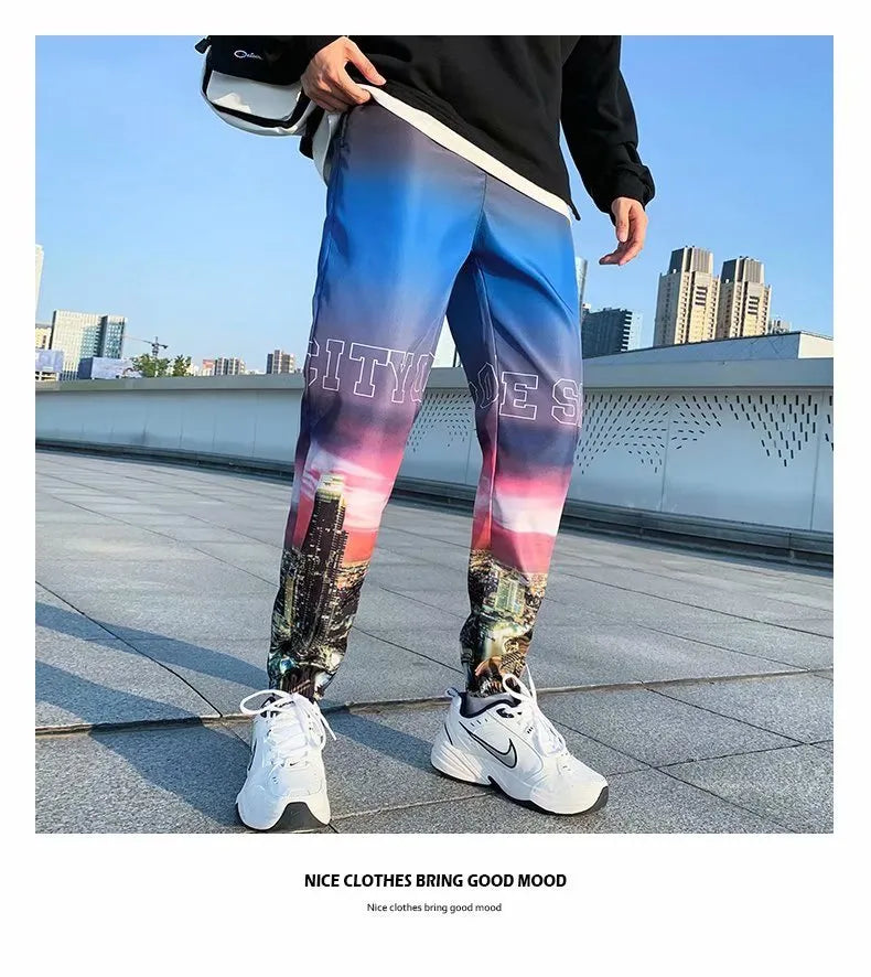 Men's gradient colour high waist nine trousers in polyester blend, available in black, blue, and white.
