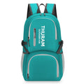 Large dark blue outdoor backpack with an air pillow belt, shown folded and unfolded.