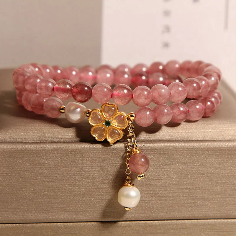 Women's twin ring bracelet with strawberry quartz four-leaf clover charms in Japanese Korean style