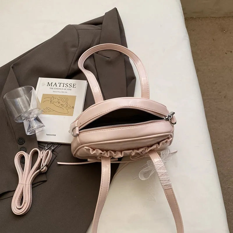 Milky White women's casual shoulder handbag with a bandage bow and sewing thread detail.