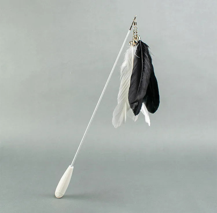 Telescopic fishing rod cat toy with goose feather teasers extended to show full length