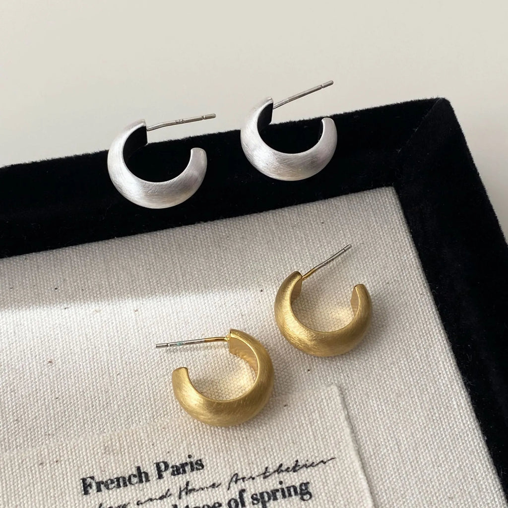 Geometric C-shaped frosted brushed copper earrings in gold as ear clips for women minimalist style