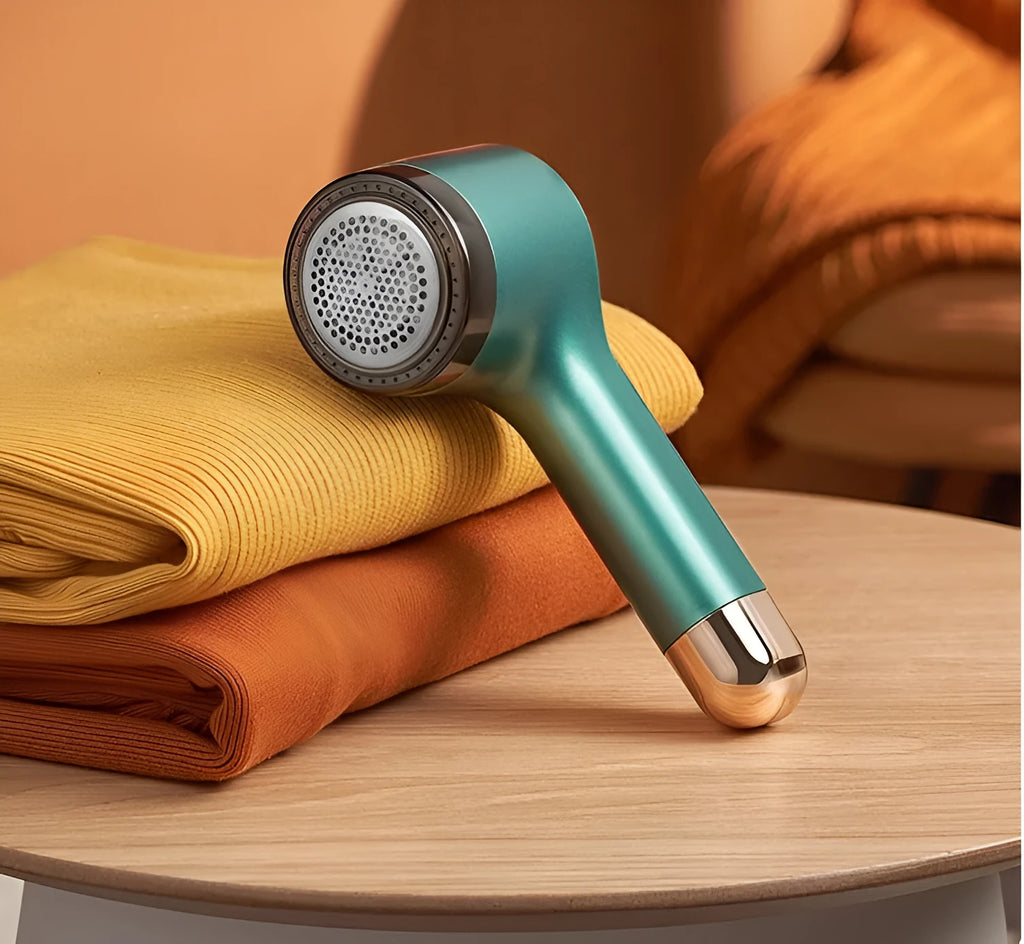 USB hair ball trimmer in choice of colours with stainless steel blade net for pet grooming and fabric care.