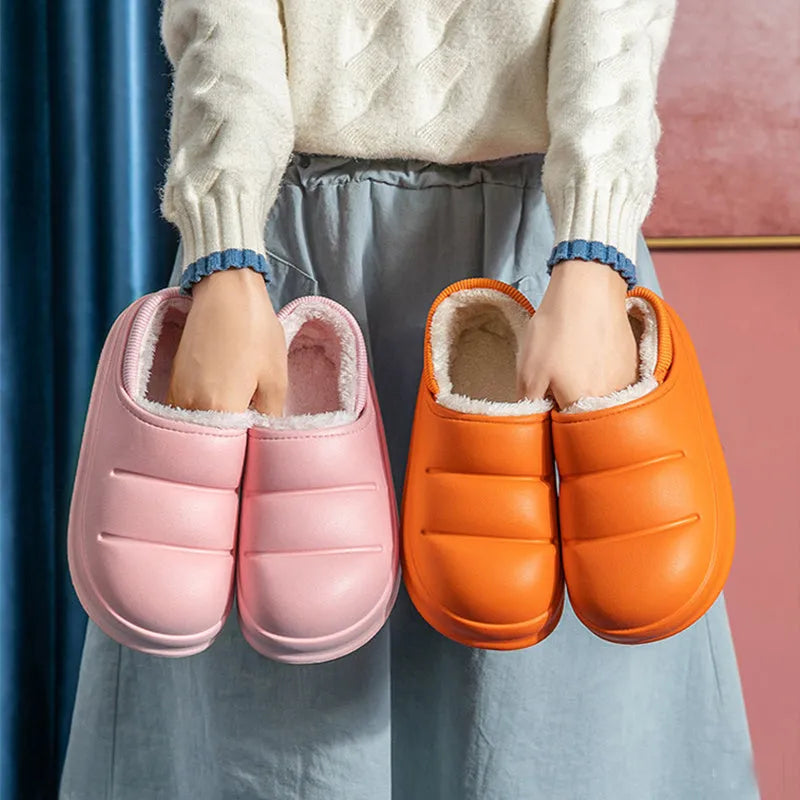 A pair of waterproof EVA garden slippers with a plush lining, shown in a solid colour with a non-slip sole.