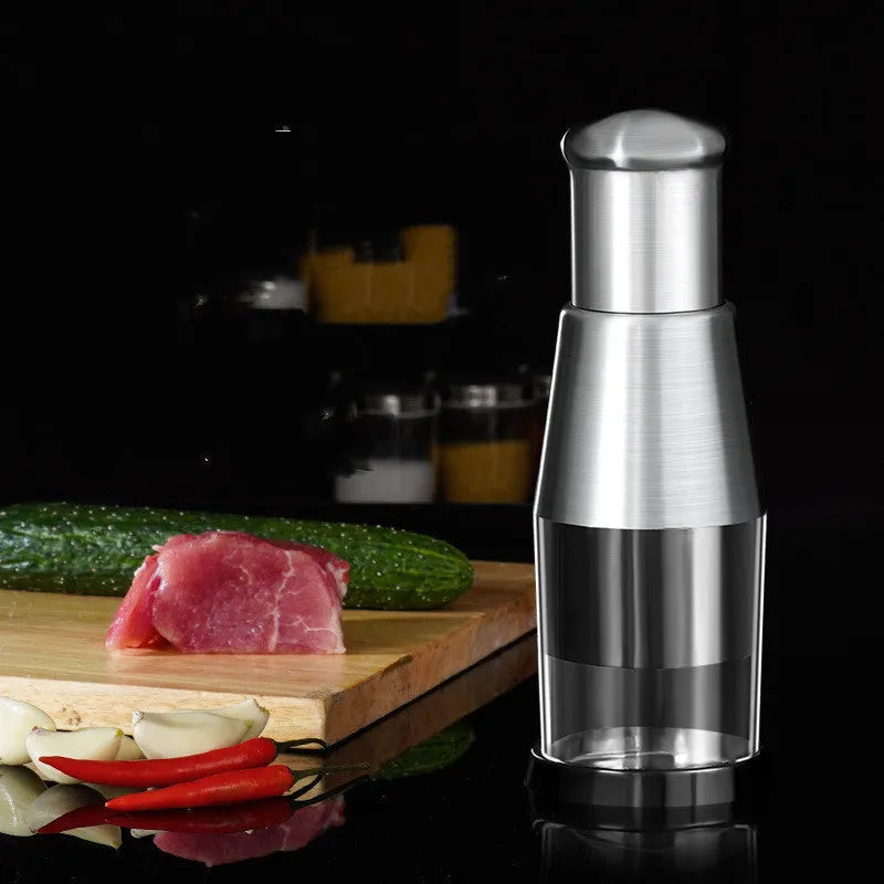 Black manual garlic press with stainless steel blades for chopping vegetables and onions